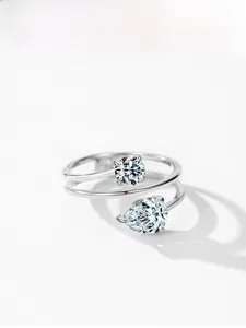 Detail view of S925 sterling silver bypass ring with round and pear cut cubic zirconia