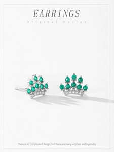 Detailed view of S925 silver crown earrings with vintage green zircon stones