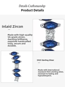Macro shot of S925 sterling silver curved earring with blue marquise cubic zirconia