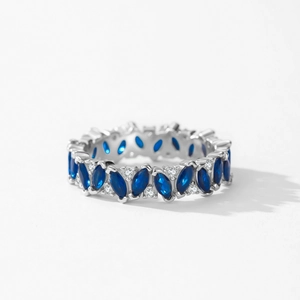 925 silver ring featuring marquise-cut blue gemstone and brilliant round diamonds