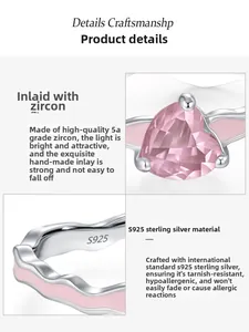 Macro detail of S925 sterling silver stamp and heart-shaped pink zircon inlay on ring