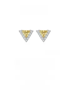 Detail of triangle silver stud earrings with a yellow center stone and diamond halo