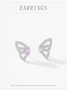 Detail of silver butterfly earrings with pink marquise stone and sparkling zircons