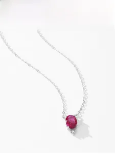 Macro view of water-drop garnet pendant and zircon on 925 silver necklace chain