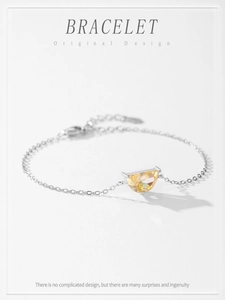 Detailed macro view of S925 silver bracelet featuring a yellow half-moon citrine gemstone