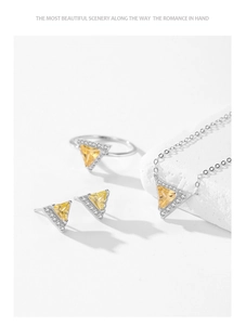 Macro shot of S925 sterling silver set with triangle yellow zircons and white stones