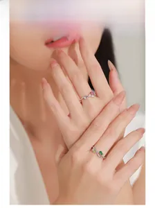Detailed model display of 925 silver rings with pear-cut emerald and pink stones