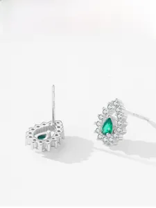 Close-up of S925 sterling silver pear-cut green gemstone earrings with white zircon halo