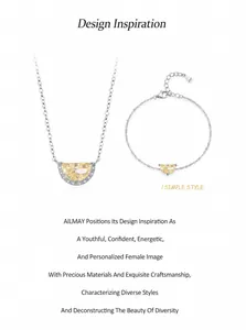 Detail view of S925 sterling silver stamp on yellow zircon crescent necklace and bracelet set