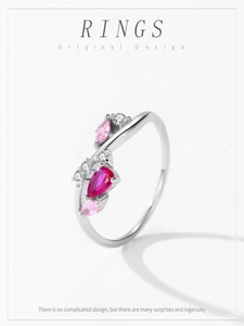 Macro shot of S925 silver vine ring with pink zircon and marquise-cut gems