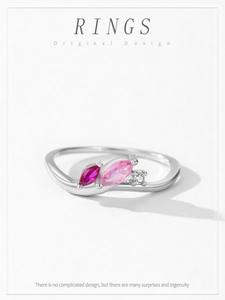 Macro shot of 925 sterling silver ring with marquise-cut red and pink gemstones