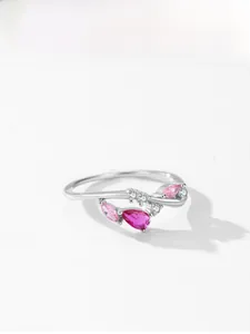 Close-up of S925 silver vine ring with pink pear-cut zircon and micro-pave stones