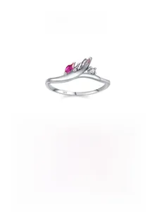 Macro detail of wave-shaped S925 silver ring featuring marquise red and pink gemstones
