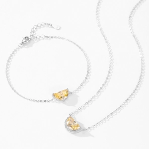 Elegant 925 sterling silver necklace and bracelet set with yellow semi-circle gemstones