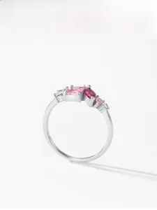 Macro detail of 925 silver ring featuring pink stones and sparkling cubic zirconia