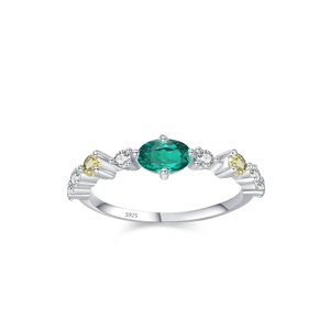 Vintage 925 sterling silver ring with oval emerald and zircon on white background