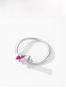 Detail of 925 sterling silver ring featuring a pink marquise and purple oval gemstone