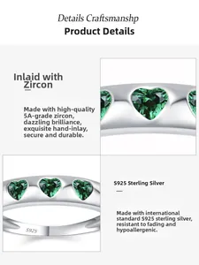 Macro view of S925 sterling silver band with S925 stamp and emerald zircon heart
