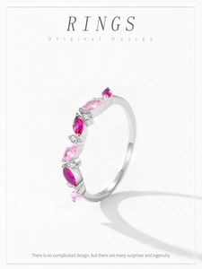 Macro detail of S925 silver ring featuring marquise-cut pink and ruby stones