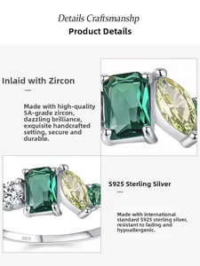 Detail of 925 sterling silver ring with 5A emerald and marquise cut cubic zirconia