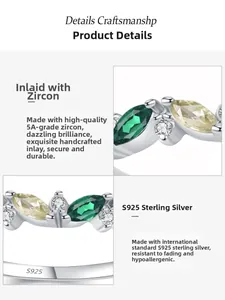 Macro detail of leaf-shaped green zircon and S925 sterling silver stamp on the ring