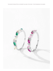 Detailed close-up of S925 silver marquise rings with colorful stones and inner engraving