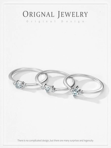 Detailed view of three minimalist S925 silver rings with square, triangle, and teardrop stones