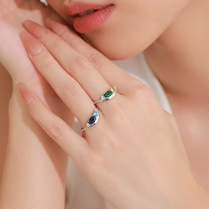 Elegant S925 sterling silver rings with emerald cut gemstones in a wavy geometric design