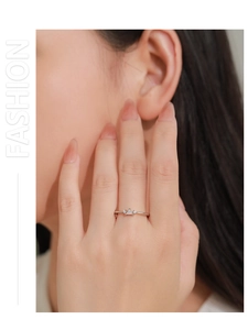Close-up of minimalist S925 silver ring with marquise zircon stones on finger