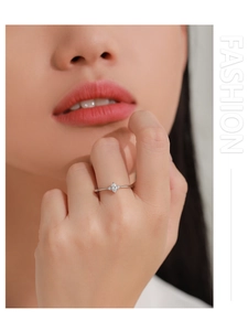 Close-up of S925 sterling silver ring with marquise cut zircon and side stones on finger