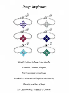 Detalle de anillos de cadena en plata 925 ajustables con tréboles de seis colores