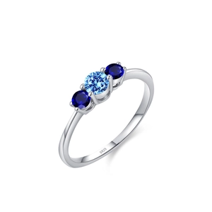 Bague en argent sterling 925 ornée de trois pierres bleues rondes au design épuré