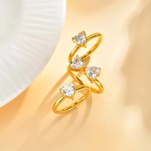 Gold multi-layer spiral ring set with four heart-shaped white cubic zirconia stones