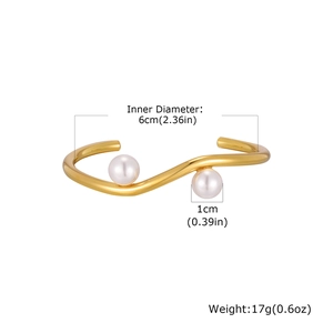 Detail showing dimensions of gold wavy cuff bracelet with pearls, 6cm inner diameter