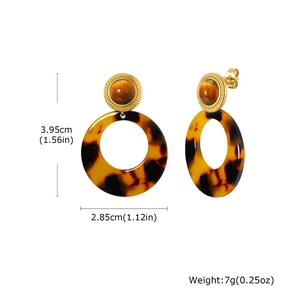 Detail view of tiger eye stud and tortoiseshell acetate hoop earrings with measurements