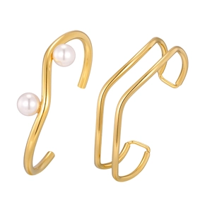 Golden wavy stainless steel bangle set with imitation pearls in a layered minimalist design