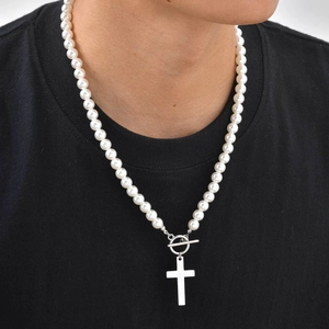 Cross pendant pearl necklace with OT toggle clasp worn on a black casual shirt