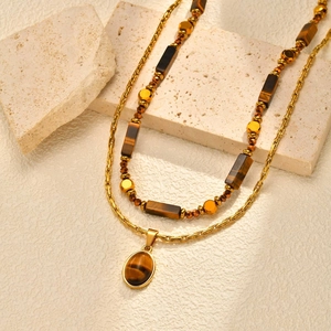 Collier double rang en acier inoxydable avec pendentif œil de tigre et perles dorées