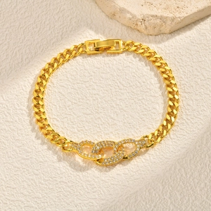 Detail of gold-plated Cuban link bracelet featuring three intertwined zircon-set oval rings