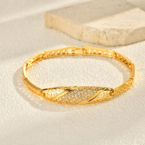 Detail of 24K gold plated elephant bracelet with pavé cubic zirconia and buckle clasp