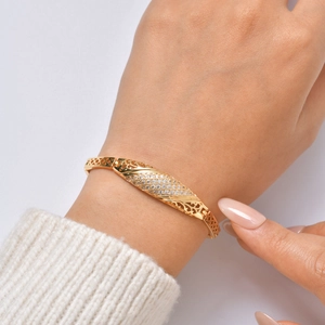 Detailed close-up of a 24K gold-plated elephant bracelet with sparkling zircon stones