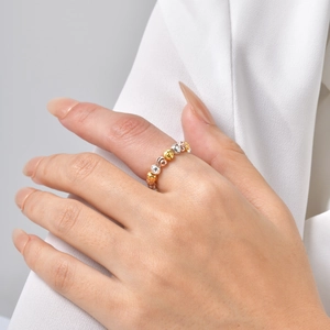 Detail of tricolor faceted watermelon beads ring in gold, silver, and rose gold finish