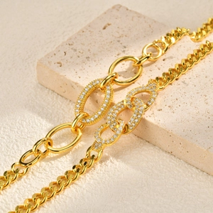 Gold plated copper curb chain bracelet with micro-pave zircon oval link design