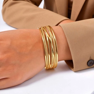 Elegant gold multi-layer open bangle with smooth and hammered textures for women