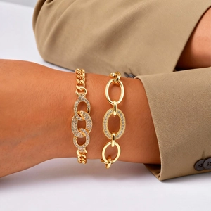 Golden micro-paved zircon bracelet set featuring cuban chains and oval link accents