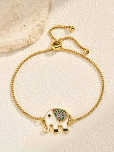 Detail of adjustable gold box chain bracelet with colorful zircon elephant charm