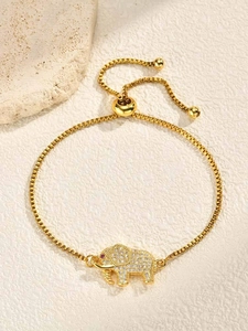 Close-up of golden elephant charm bracelet with pavé cubic zirconia and adjustable chain