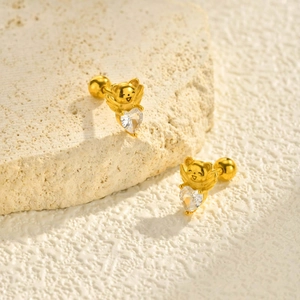Boucles d'oreilles chat ailé en acier doré avec un cristal de zircone en forme de cœur