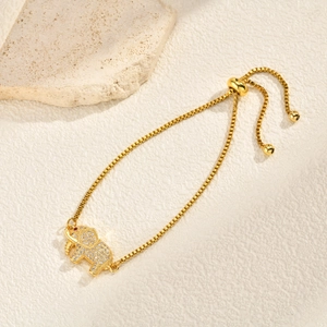 Detailed shot of an adjustable gold elephant bracelet with micro-paved cubic zirconia