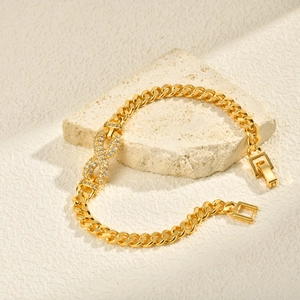 Detail of 24K gold plated infinity link bracelet with sparkling cubic zirconia inlay